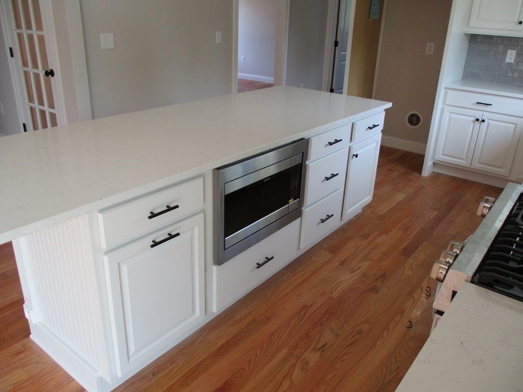 247 High Street Billerica, MA 01862 - Photo 12 of 26 a kitchen with stainless steel appliances a stove microwave and refrigerator