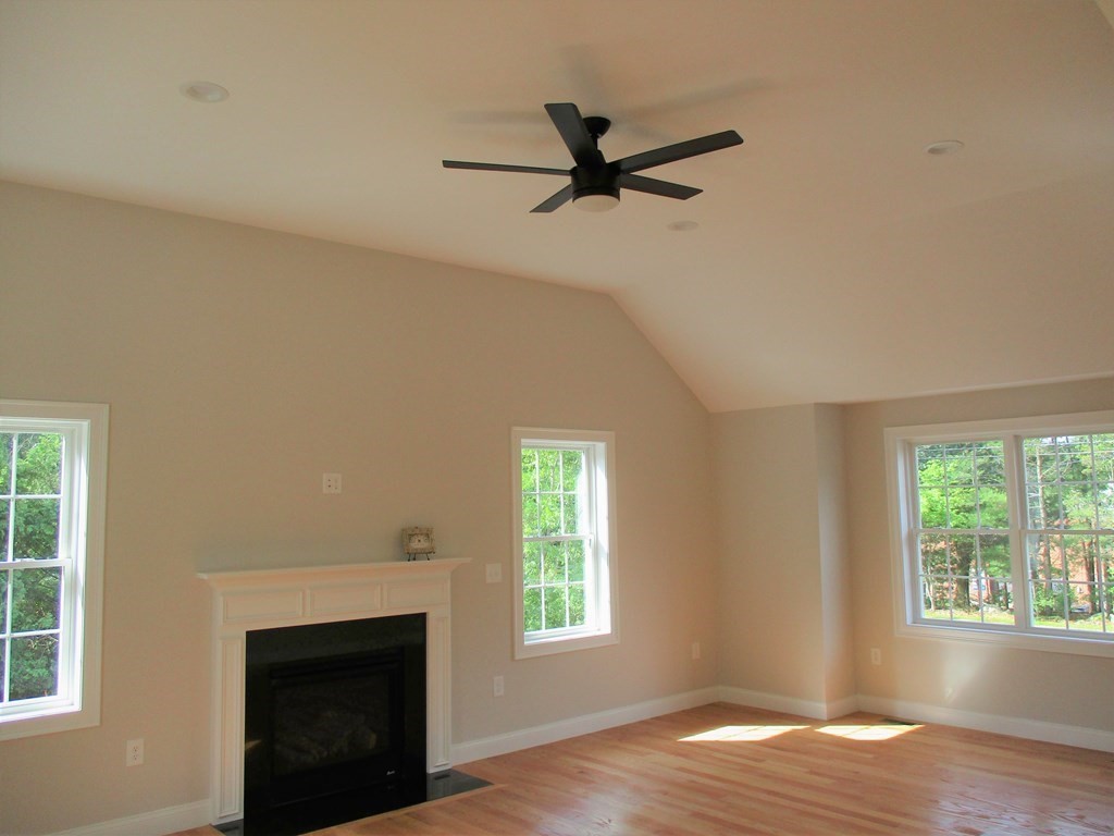 247 High Street Billerica, MA 01862 - Photo 15 of 26 a view of an empty room with wooden floor and a window