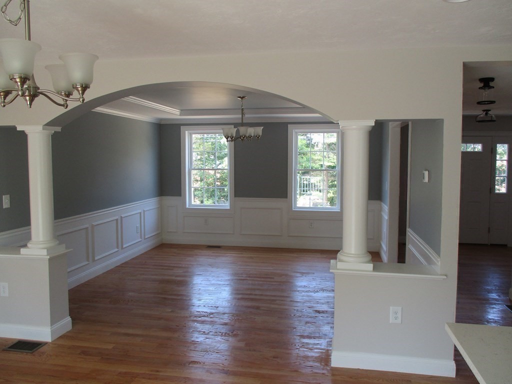 247 High Street Billerica, MA 01862 - Photo 17 of 26 wooden floor in an empty room with a window
