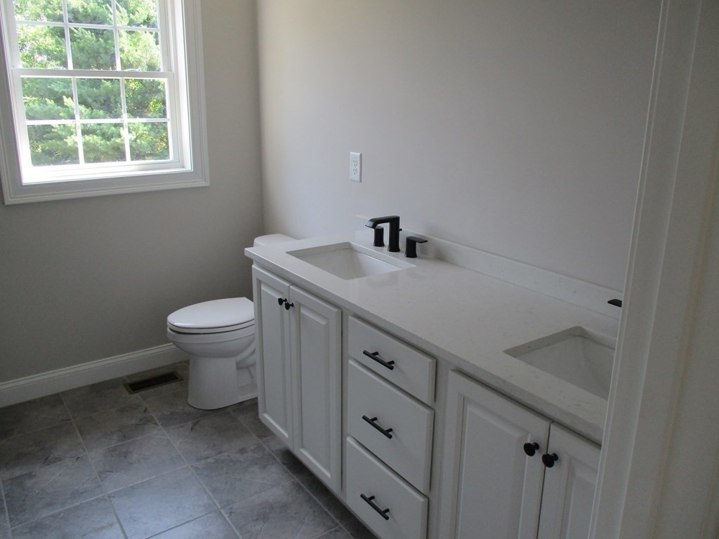 247 High Street Billerica, MA 01862 - Photo 19 of 26 a bathroom with a sink toilet and window