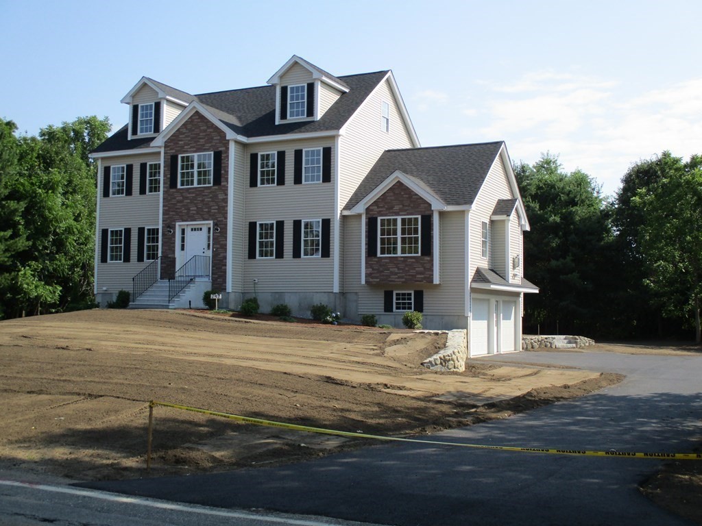 247 High Street Billerica, MA 01862 - Photo 2 of 26 a front view of a house with a yard