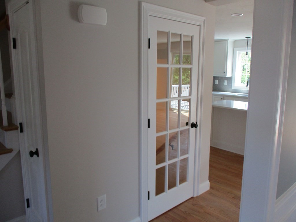 247 High Street Billerica, MA 01862 - Photo 23 of 26 an empty room with wooden floor and entrance