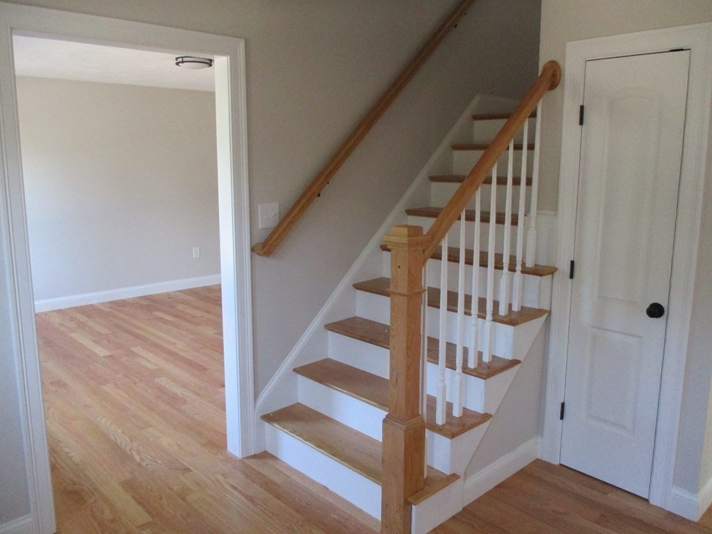 247 High Street Billerica, MA 01862 - Photo 26 of 26 a view of staircase with wooden floor and white walls