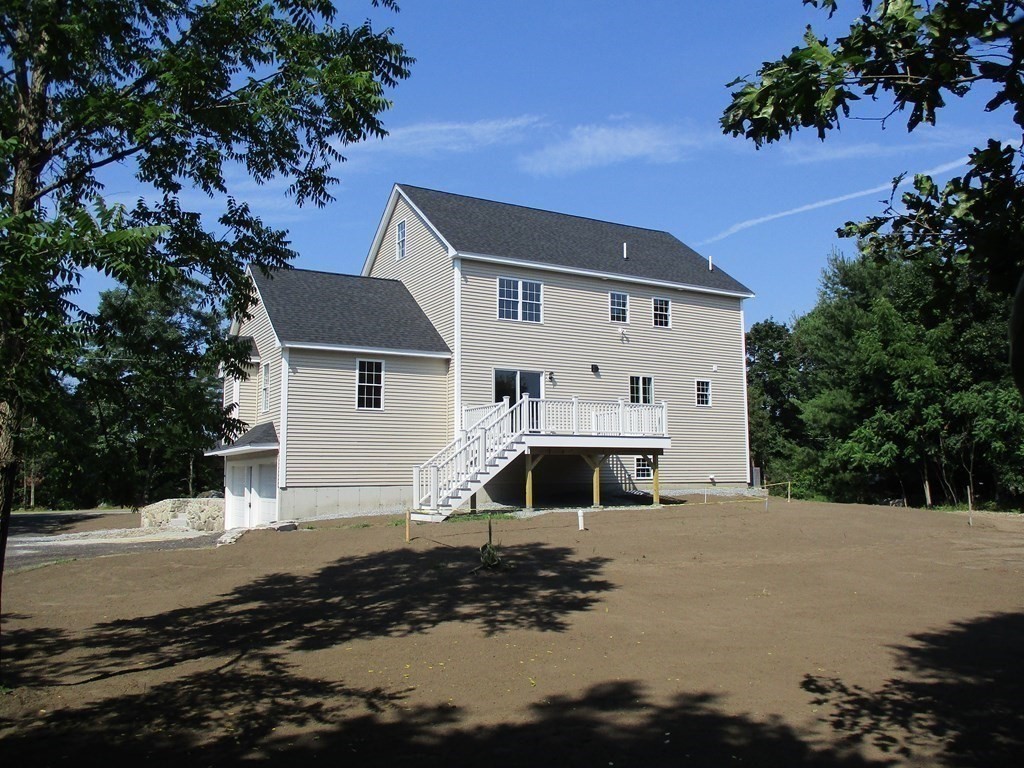 247 High Street Billerica, MA 01862 - Photo 3 of 26 a view of a house with a yard