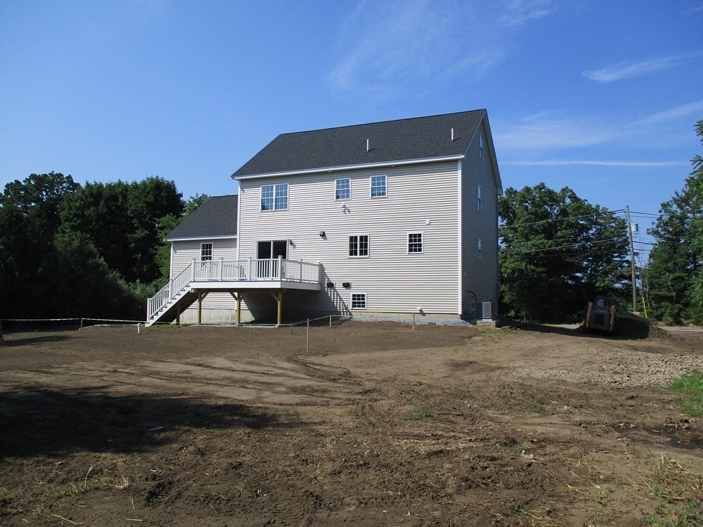 247 High Street Billerica, MA 01862 - Photo 4 of 26 a front view of a house with a yard