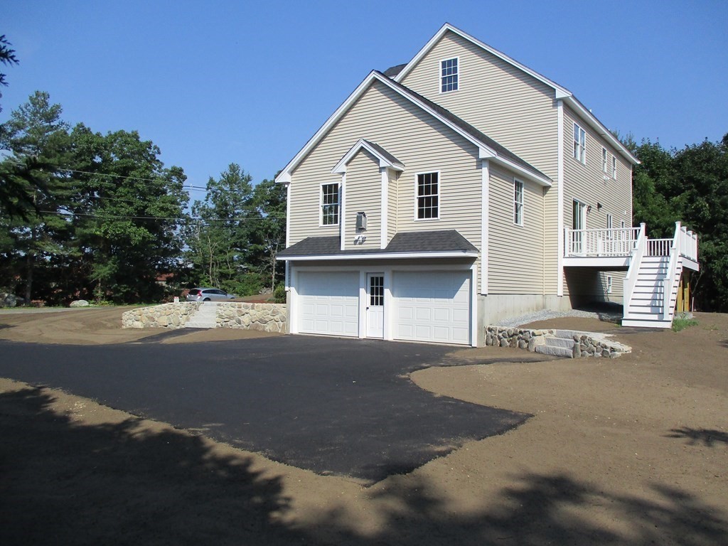 247 High Street Billerica, MA 01862 - Photo 5 of 26 a front view of a house with a yard