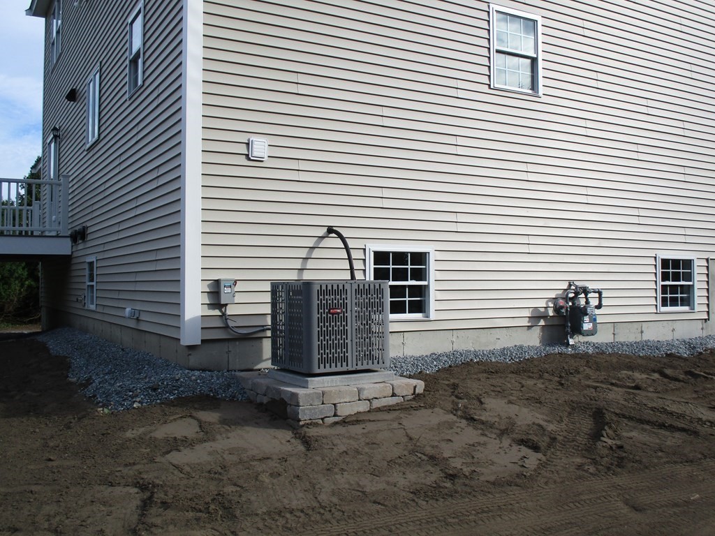 247 High Street Billerica, MA 01862 - Photo 8 of 26 a view of a house with a yard and a large window