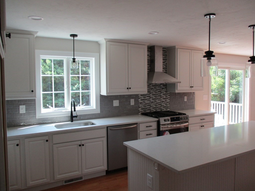 247 High Street Billerica, MA 01862 - Photo 9 of 26 a kitchen with a sink stove and window