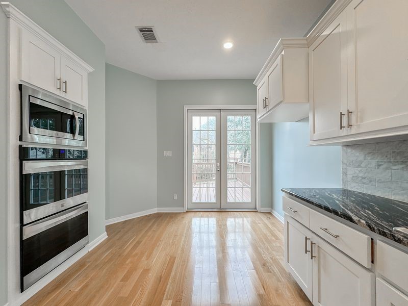 1223 Normans Woods Street Houston, TX 77077 - Photo 16 of 32 Enjoy access to the back deck from the kitchen