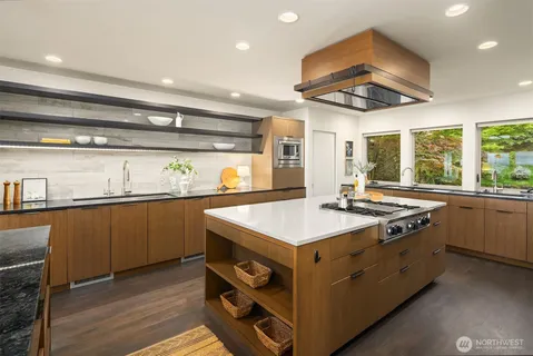 a kitchen with a stove a sink and a refrigerator