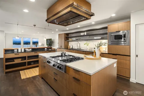 a kitchen with a stove and a refrigerator