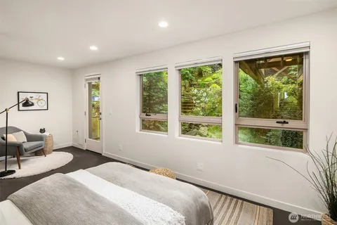 a bedroom with a large bed and a large window