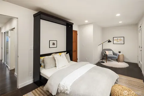 a bedroom with a bed and a desk