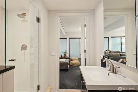 a en suite bathroom with a sink and a mirror