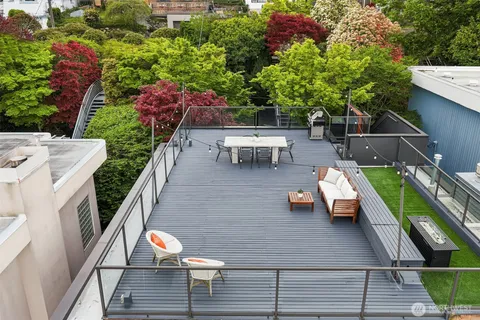 an outdoor sitting area with chairs