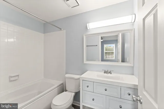 a view of a hallway with washer and dryer