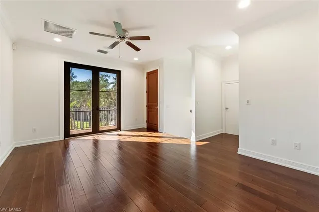 a view of balcony with wooden floor and fence