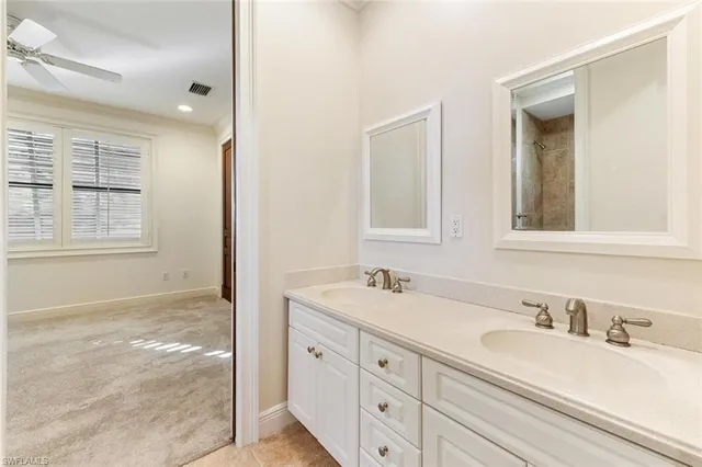 a white bath tub sitting next to a toilet