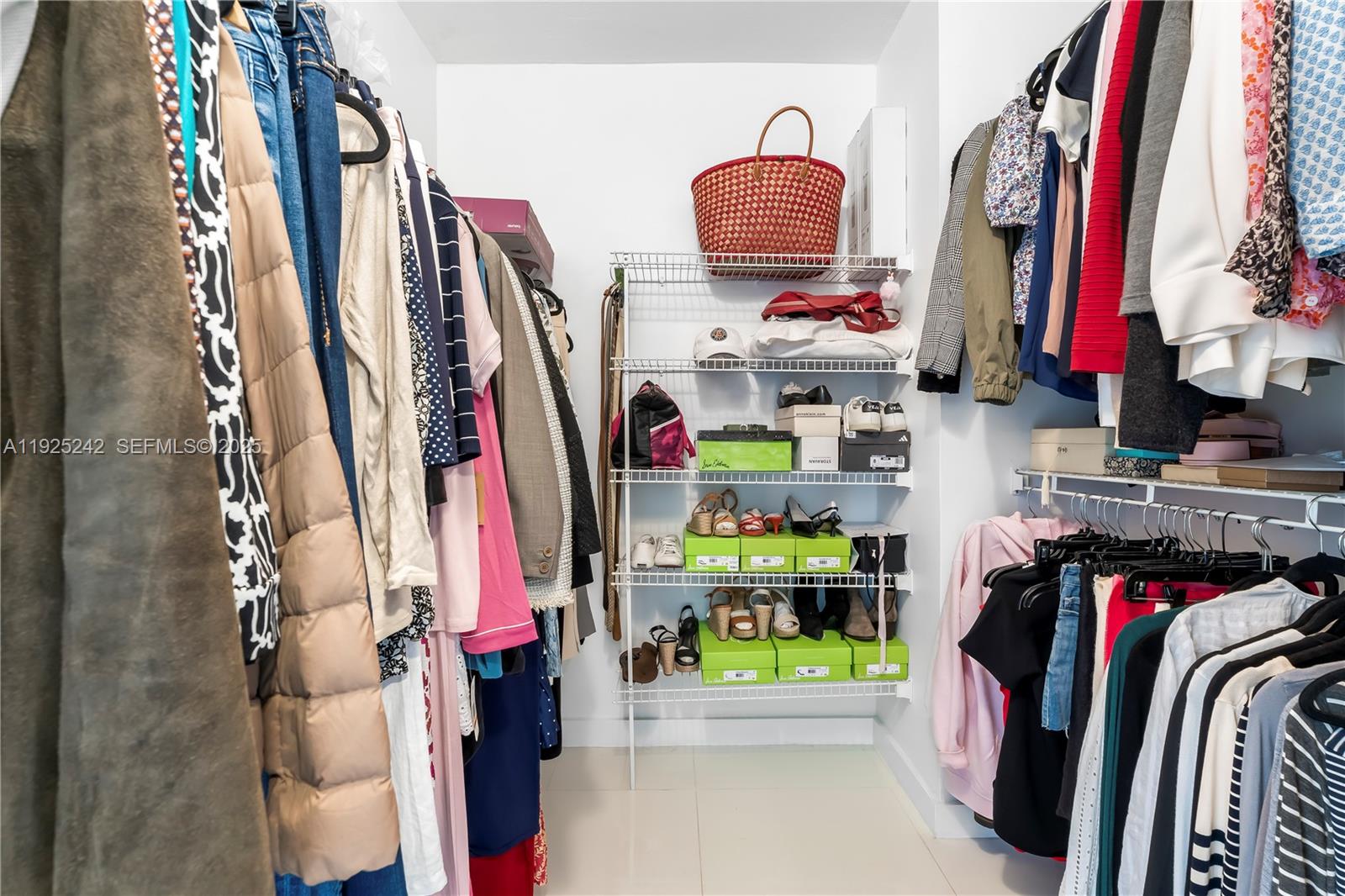 1688 West Avenue, Unit 401 Miami Beach, FL 33139 - Photo 13 of 20 a view of walk in closet with clothes and shoes