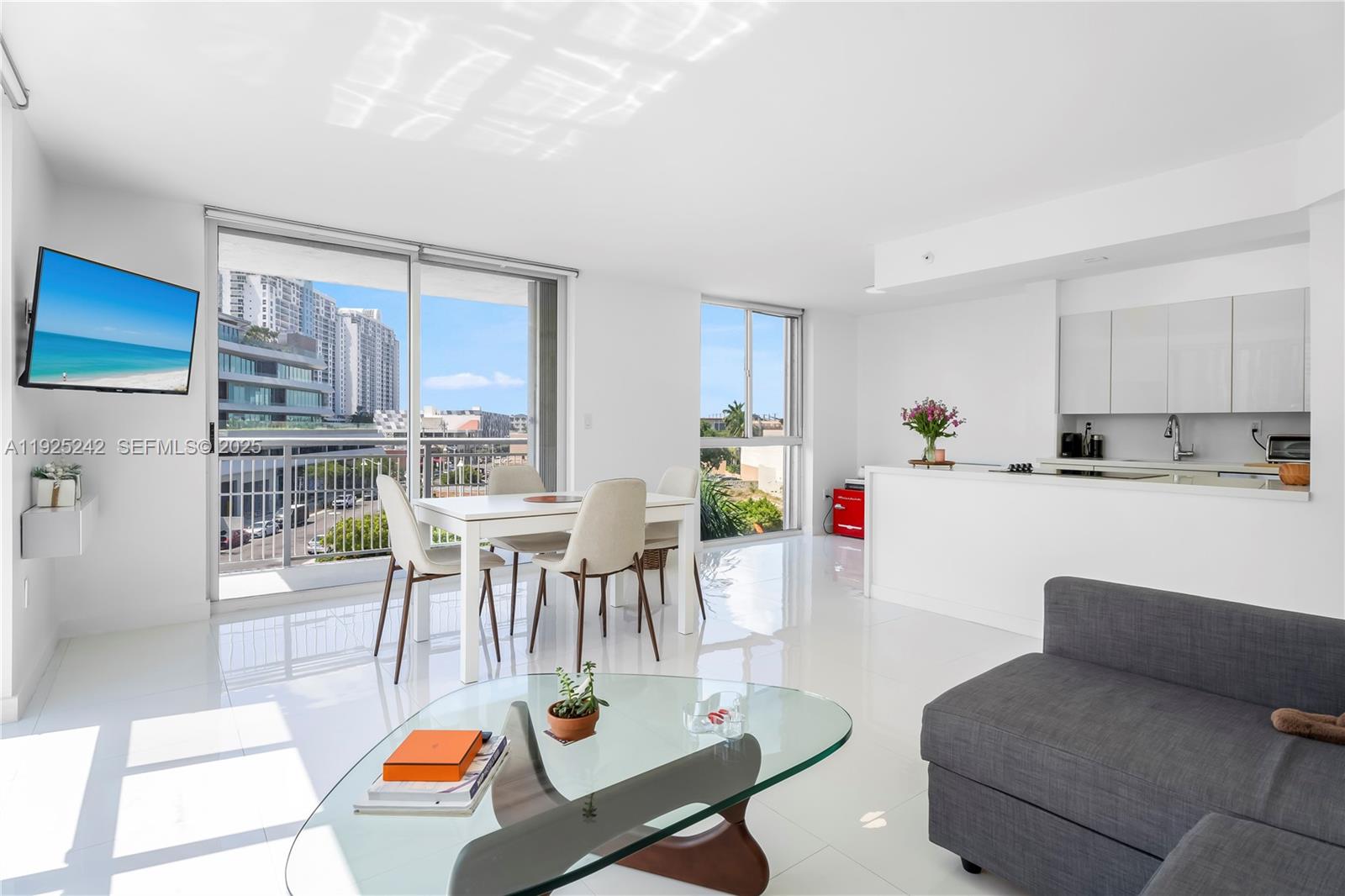 1688 West Avenue, Unit 401 Miami Beach, FL 33139 - Photo 4 of 20 a living room with furniture and kitchen view