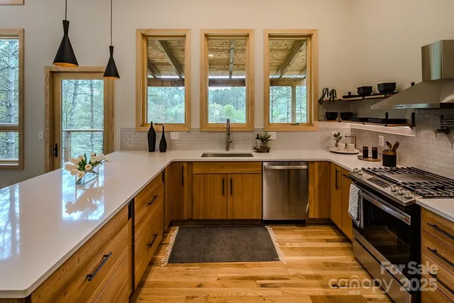 a kitchen with a sink stove and cabinets