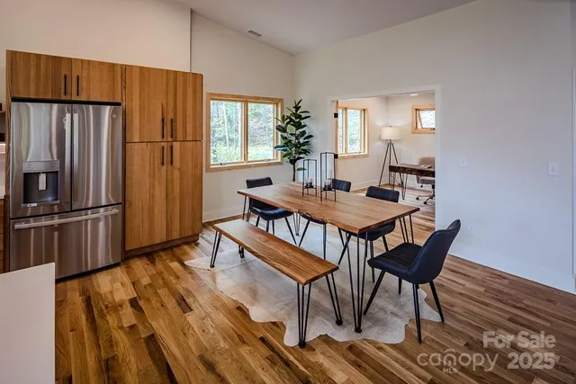 a view of a dining room with furniture window and wooden floor