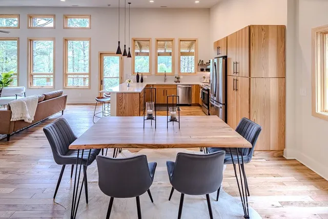 a view of a dining room with furniture window and wooden floor
