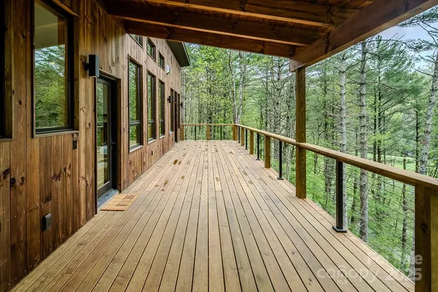 a view of balcony with wooden floor