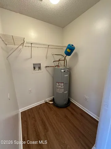 a view of storage and utility room with empty racks