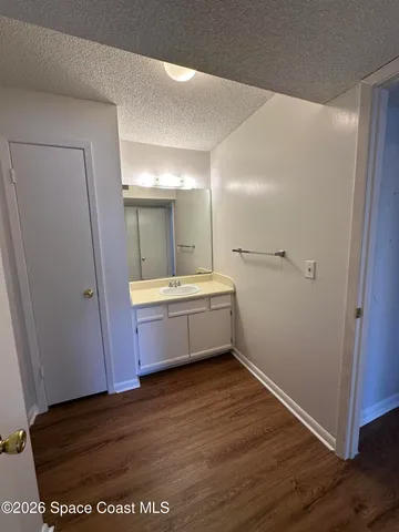 a bathroom with a sink a mirror and a shower