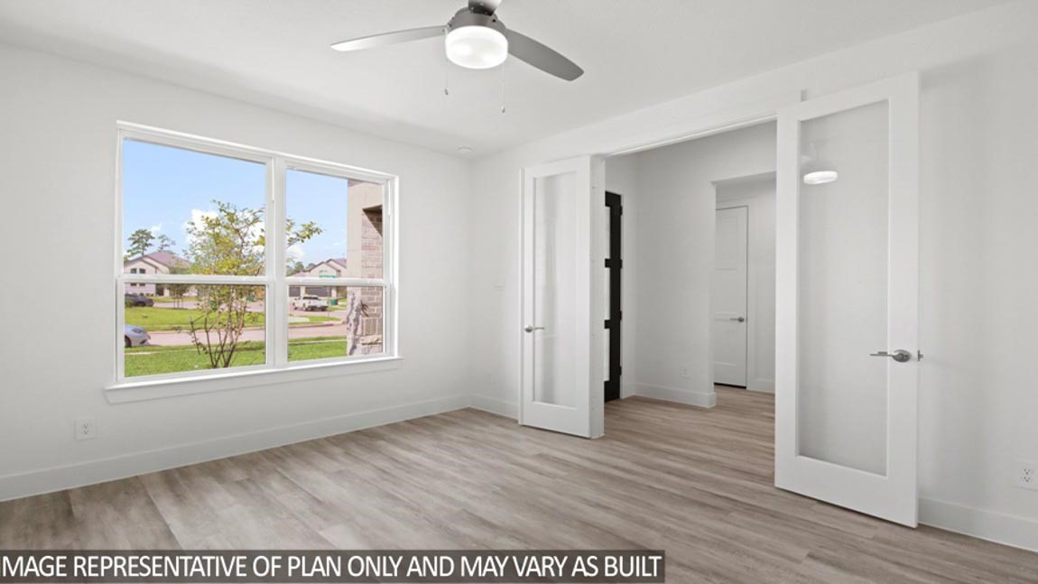 15219 Riverside Drive Baytown, TX 77523 - Photo 8 of 14 an empty room with wooden floor and window