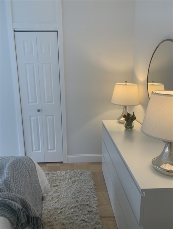 65 East India Row, Unit 10A Boston, MA 02110 - Photo 13 of 17 a room with a sink and a mirror