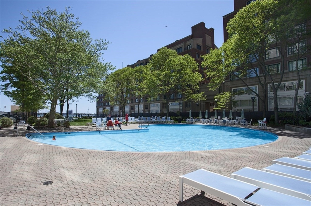 65 East India Row, Unit 10A Boston, MA 02110 - Photo 17 of 17 a view of a house with a yard and sitting area