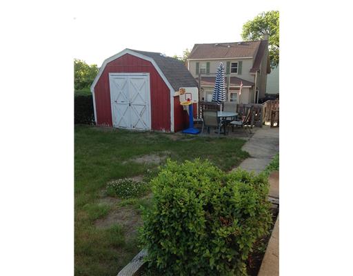 556 Bernon Street Woonsocket, RI 02895 - Photo 11 of 12 Yard/Garden. fenced in side yard with shed