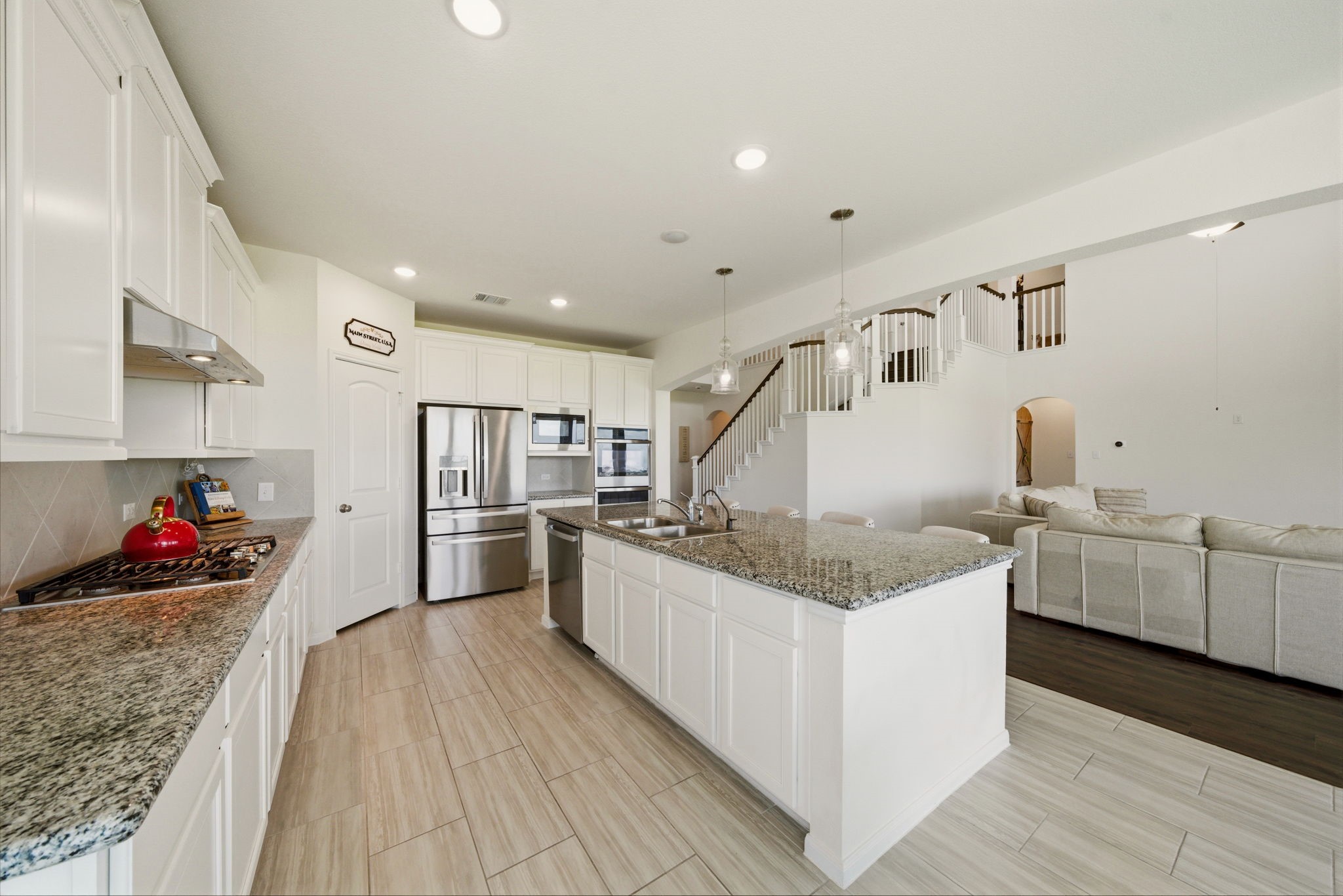 4012 Edgewater Ter Lane Waller, TX 77484 - Photo 15 of 42 a kitchen with stainless steel appliances granite countertop a stove and a sink