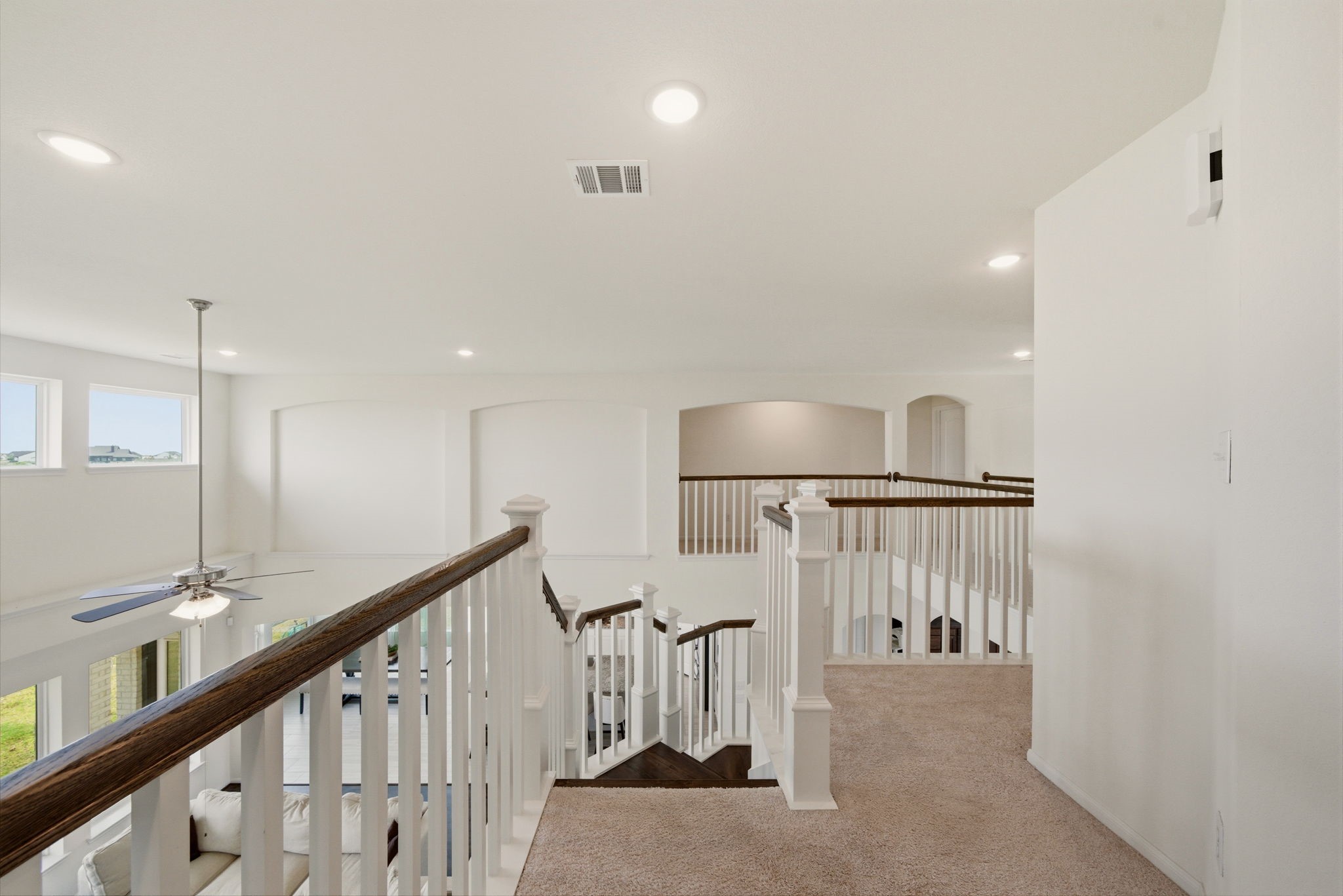 4012 Edgewater Ter Lane Waller, TX 77484 - Photo 20 of 42 a view of staircase with lots of frames on wall and windows