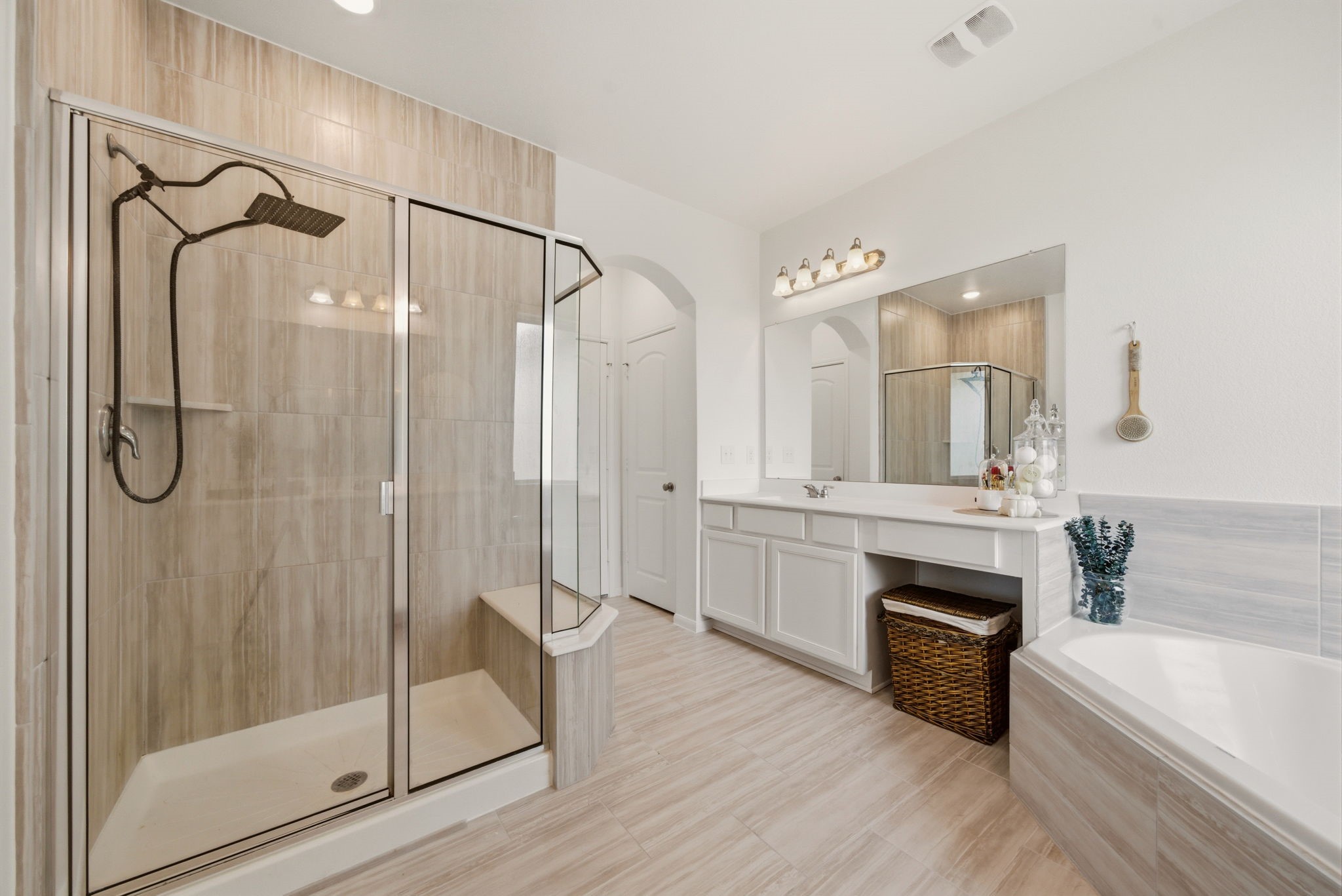 4012 Edgewater Ter Lane Waller, TX 77484 - Photo 31 of 42 a spacious bathroom with a shower a sink and a mirror
