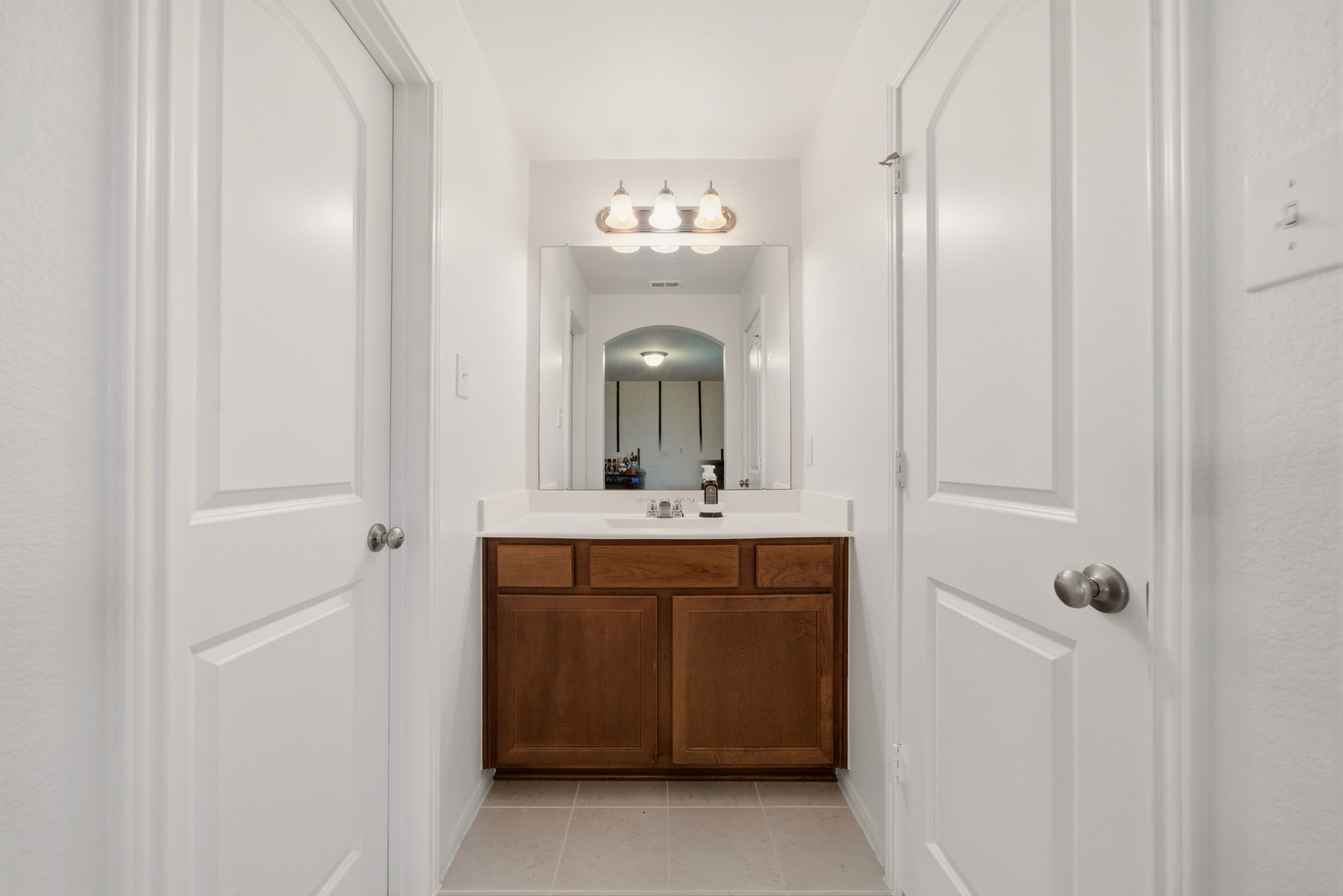 4012 Edgewater Ter Lane Waller, TX 77484 - Photo 34 of 42 a bathroom with a sink and a mirror