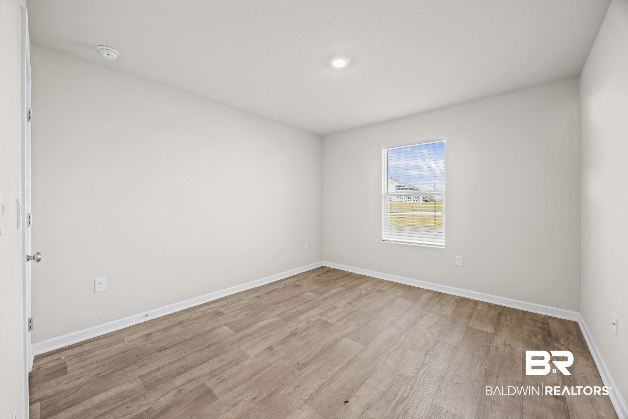 3090 Camino Real Loop Lillian, AL 36549 - Photo 19 of 29 Spare room featuring light wood-style floors