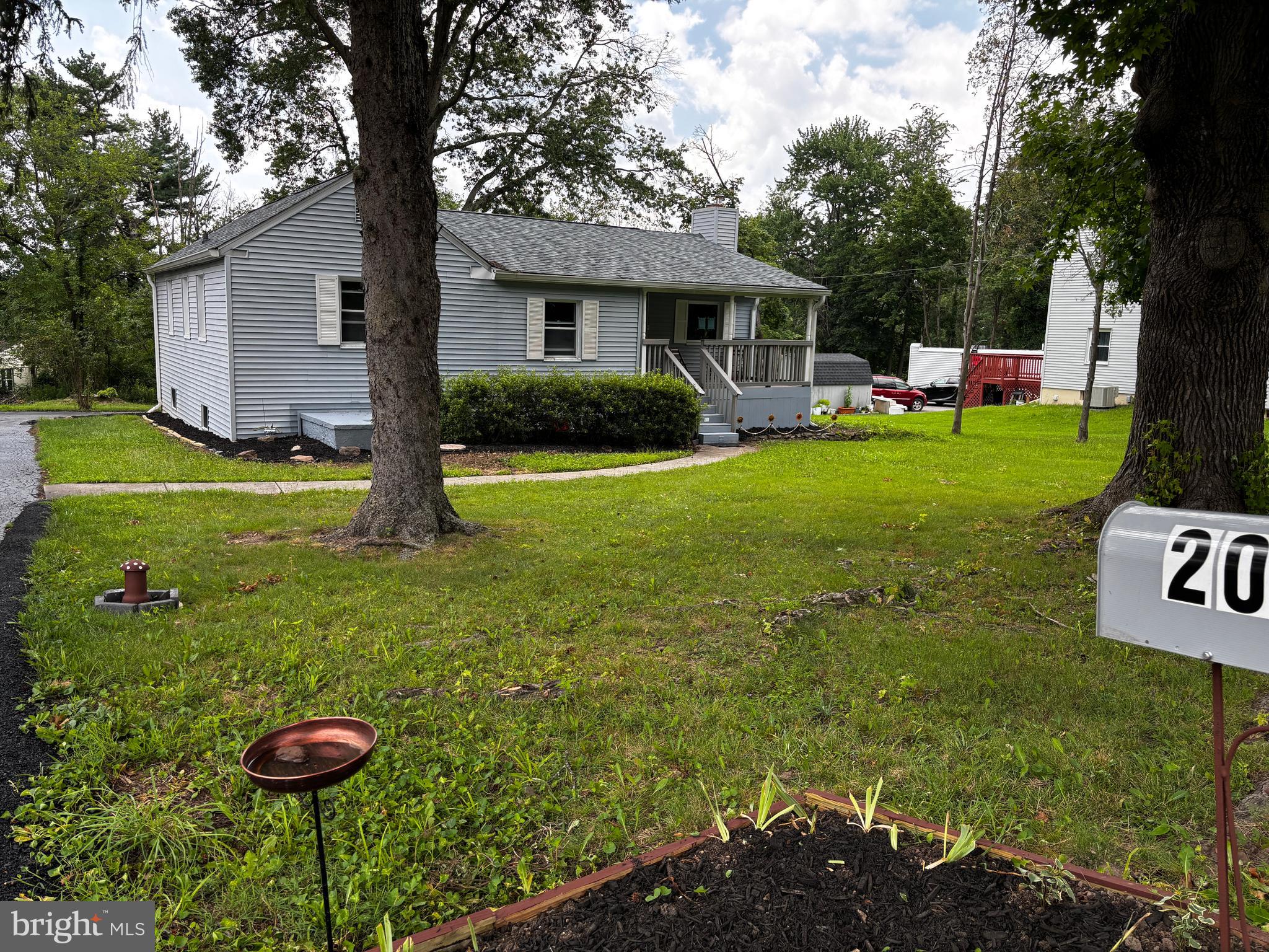 2044 Mill Road Norristown, PA 19403 - Photo 14 of 55 a view of house with backyard outdoor seating and green space