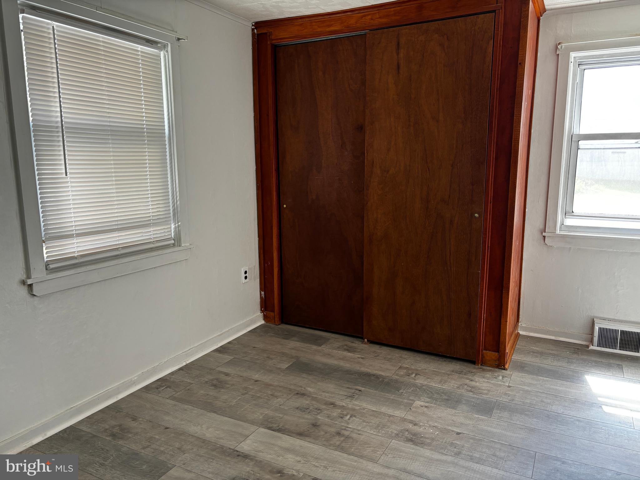 2044 Mill Road Norristown, PA 19403 - Photo 15 of 55 an empty room with wooden floor and windows