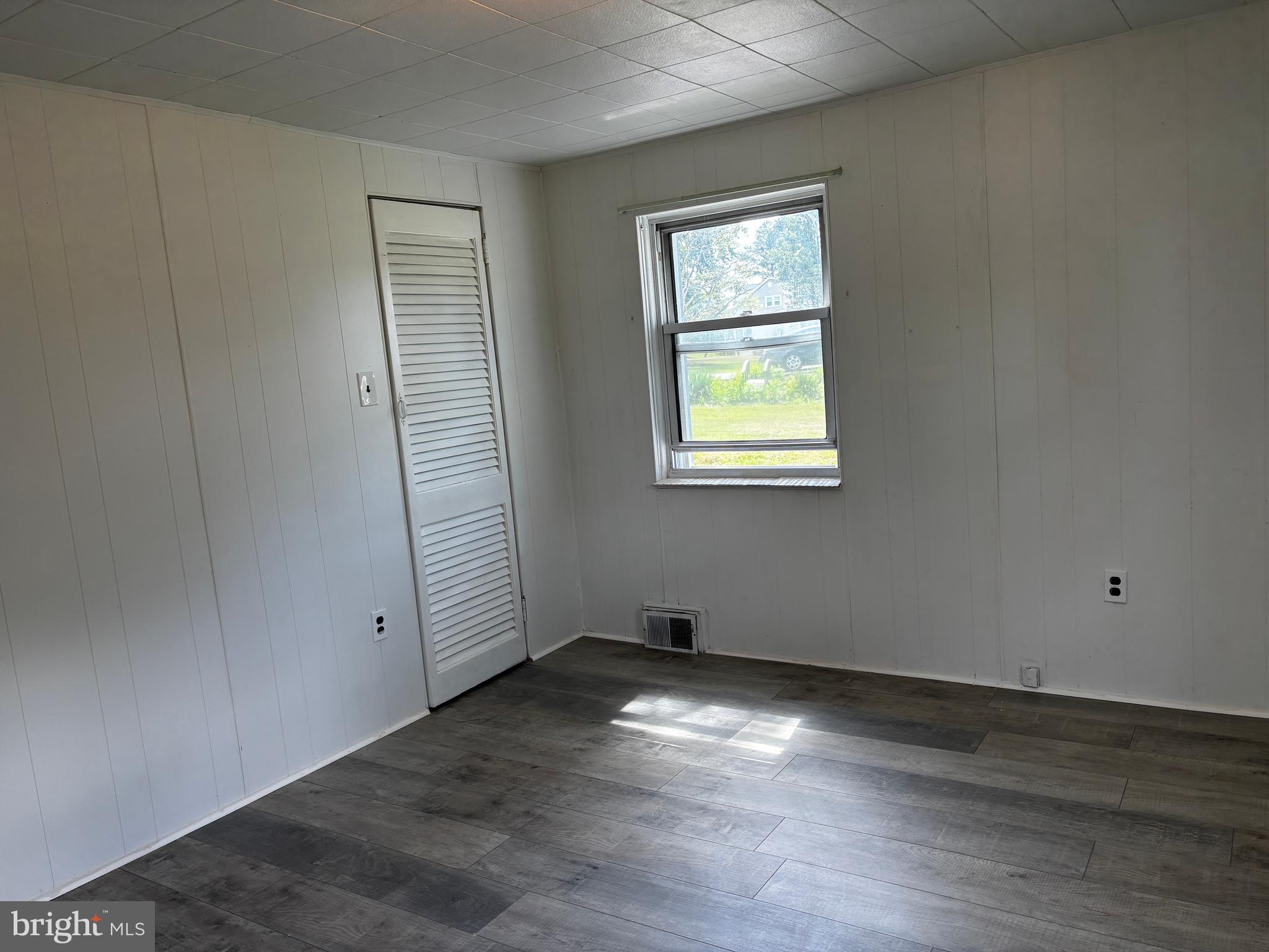 2044 Mill Road Norristown, PA 19403 - Photo 17 of 55 an empty room with wooden floor and windows