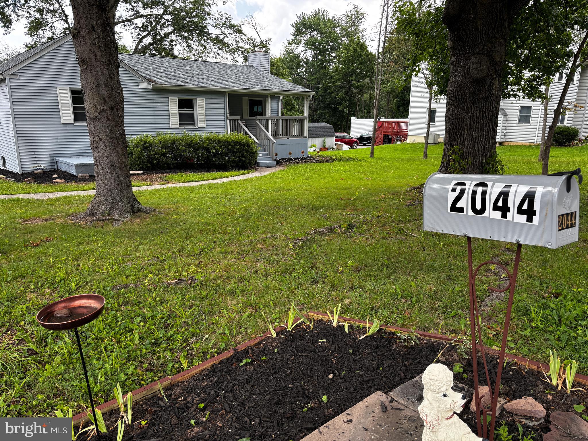 2044 Mill Road Norristown, PA 19403 - Photo 33 of 55 a view of a house with backyard and a tree