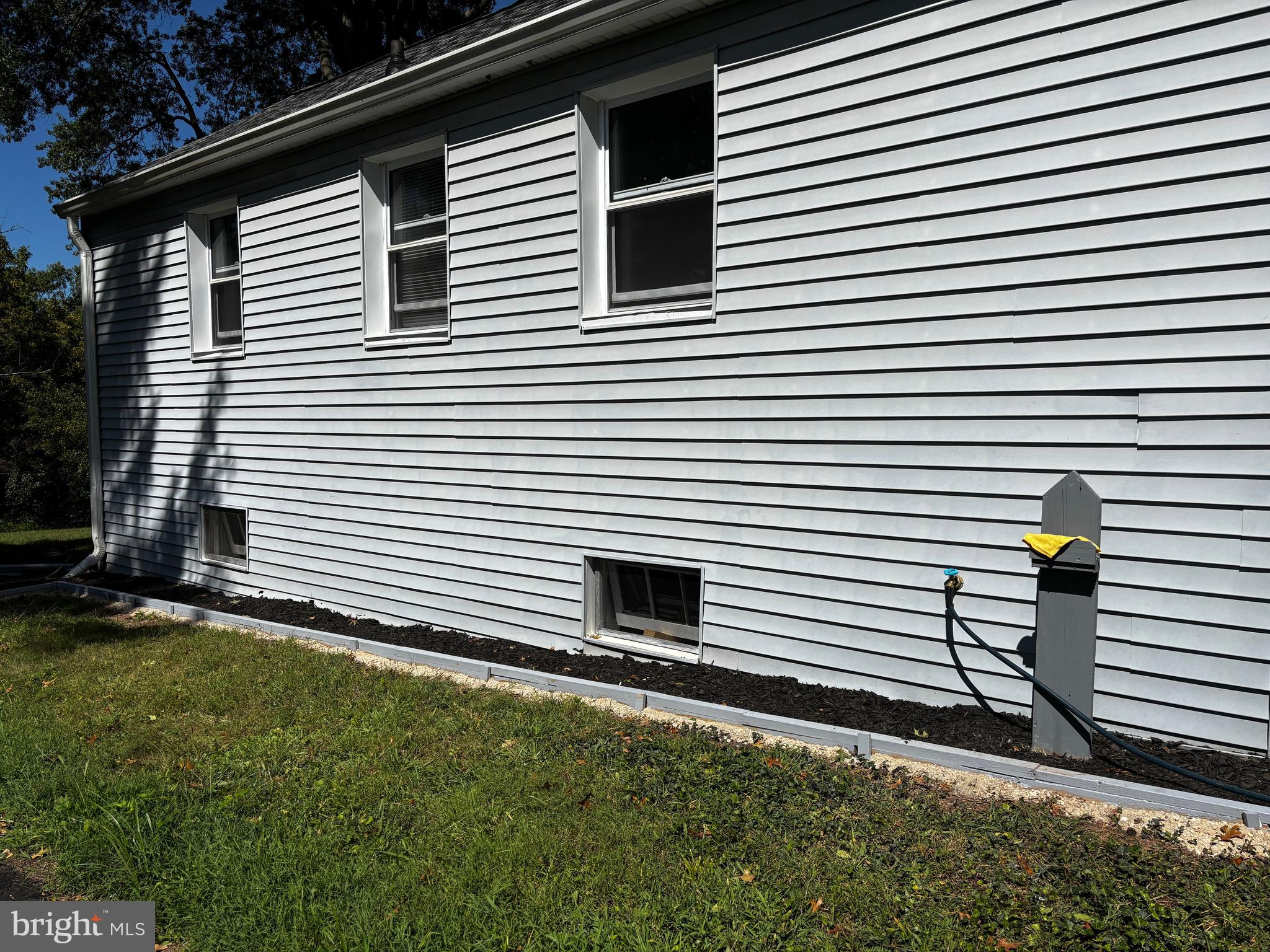 2044 Mill Road Norristown, PA 19403 - Photo 42 of 55 a view of a white house with a small yard and stairs