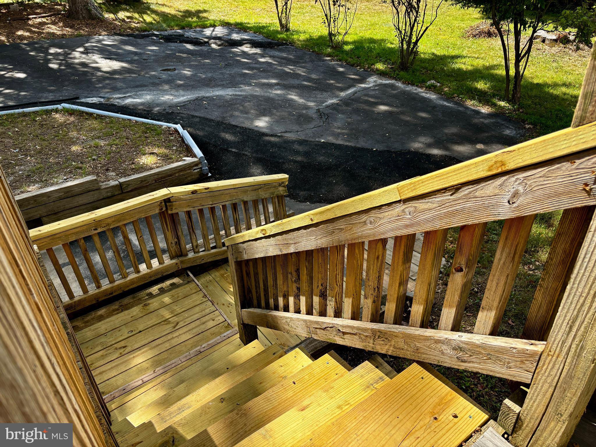 2044 Mill Road Norristown, PA 19403 - Photo 44 of 55 a view of a wooden deck with a bench
