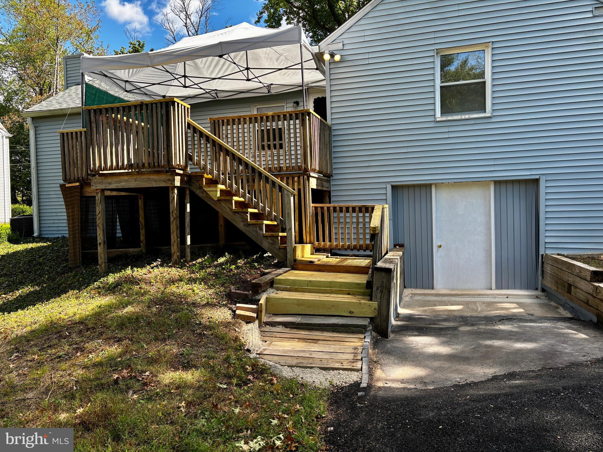 2044 Mill Road Norristown, PA 19403 - Photo 47 of 55 a front view of a house with stairs and a table