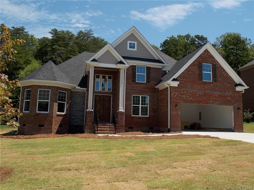 704 Old Cove Road Tega Cay, SC 29708 - Photo 1 of 1 a front view of a house with a yard