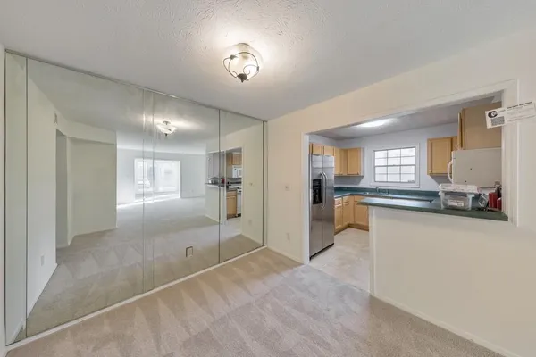 a view of a kitchen and a window
