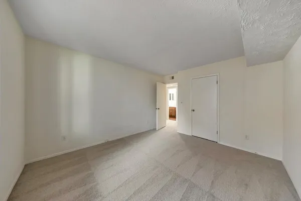 a view of an empty room and window