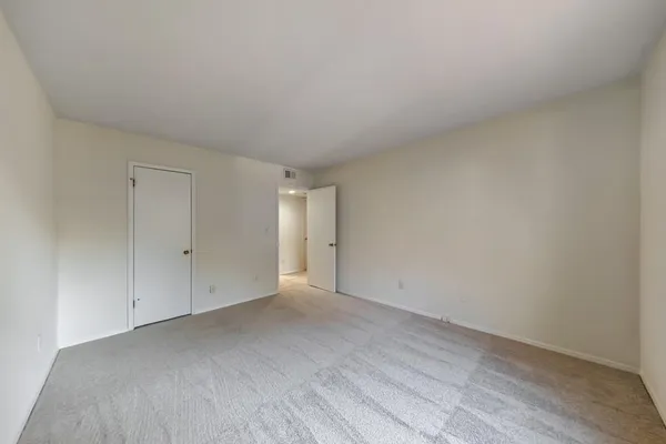 a view of an empty room and entryway